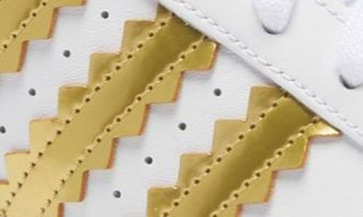 Shop Adidas Originals Superstar Sneaker In White/matte Gold/core Black