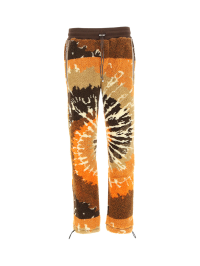 Shop Amiri Trousers In Orange / Black-polar Fleece