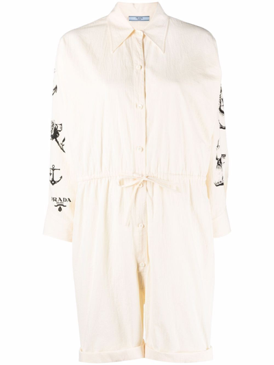 Shop Prada Printed Chambray-canvas Jumpsuit In Beige
