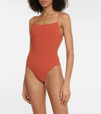 Shop Totême Smocked Swimsuit In Burnt Orange