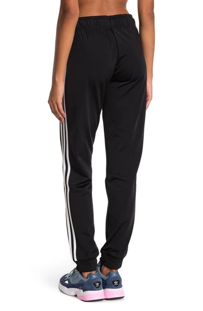 Shop Adidas Originals Adidas Primegreen Essentials Warm-up Slim Tapered 3-stripes Track Pants In Black