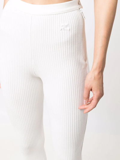 Shop Courrèges Ribbed High-waisted Flared Leg Trousers In White