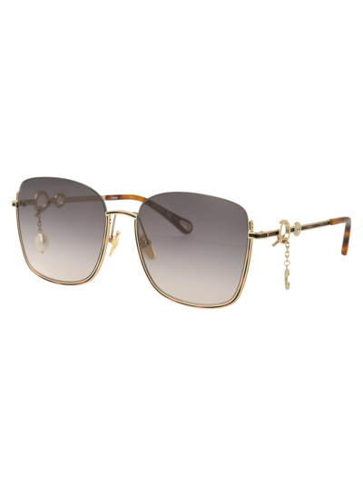 Shop Chloé Eyewear Ch0070sk Sunglasses In 001 Gold Gold Blue