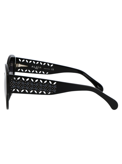 Shop Alaïa Aa0040s Sunglasses In 001 Black Black Grey