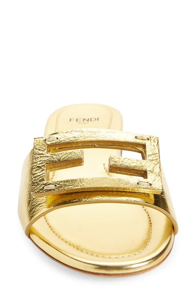 Shop Fendi Baguette Metallic Slide Sandal In Gold