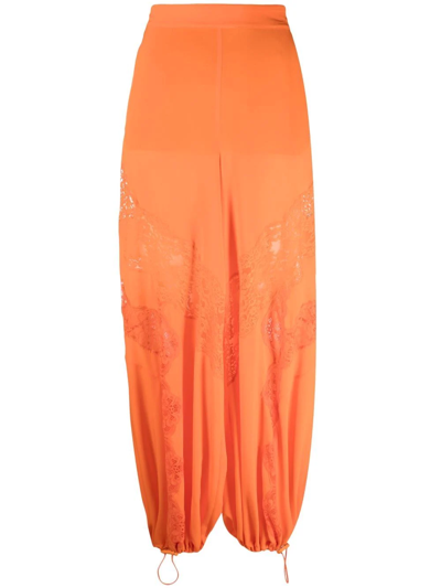 Shop Stella Mccartney Lace-insert Parachute Trousers In Orange