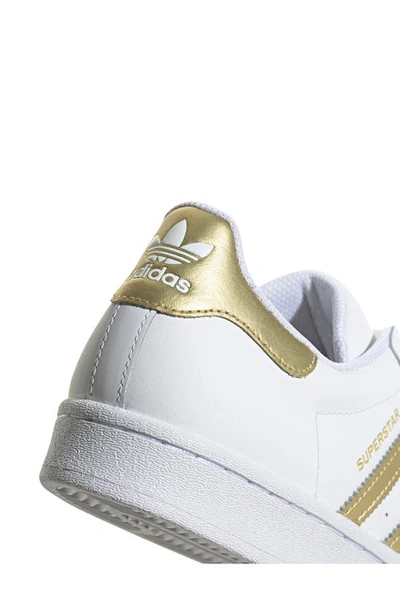 Shop Adidas Originals Superstar Sneaker In White/ Gold Met/ White