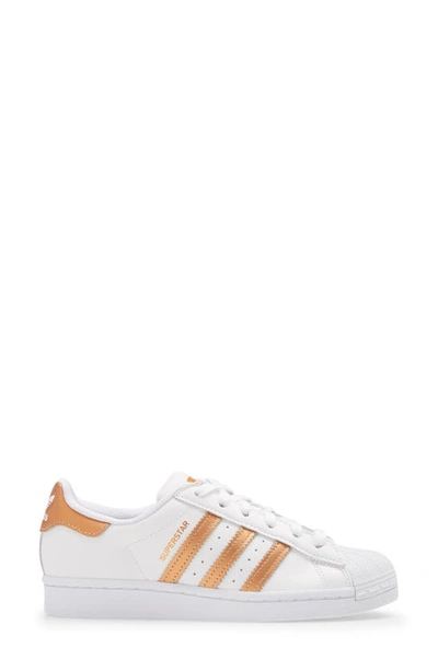 Shop Adidas Originals Superstar Sneaker In White/ Copper Met/ Core Black