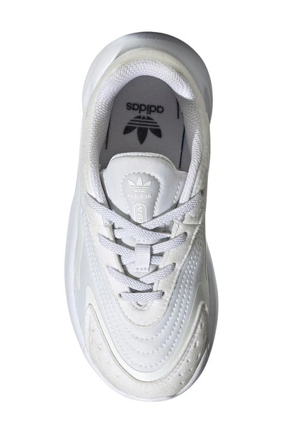 Shop Adidas Originals Kids' Ozelia Sneaker In White/ White/ White
