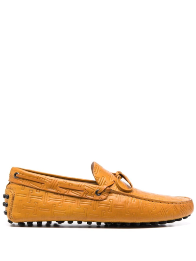 Shop Tod's Gommino Embossed Loafers In Yellow