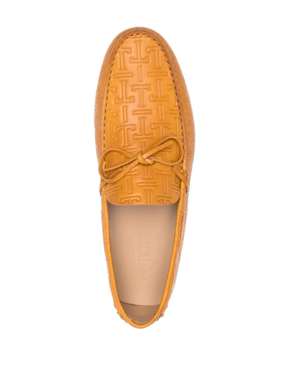 Shop Tod's Gommino Embossed Loafers In Yellow