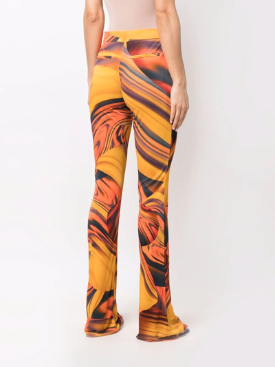 Shop Attico Abstract-print Flared Trousers In Orange