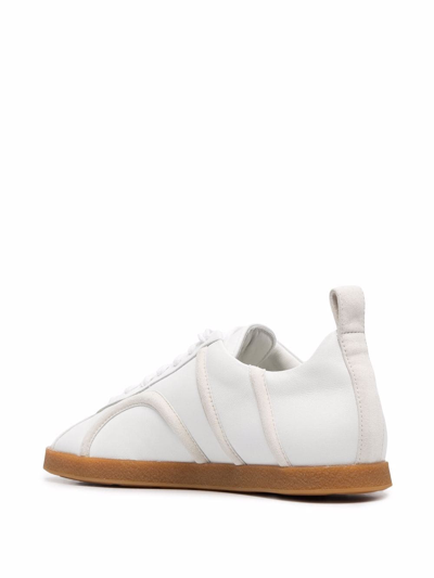 Shop Totême Raised Monogram Sneakers In White