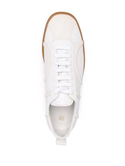 Shop Totême Raised Monogram Sneakers In White