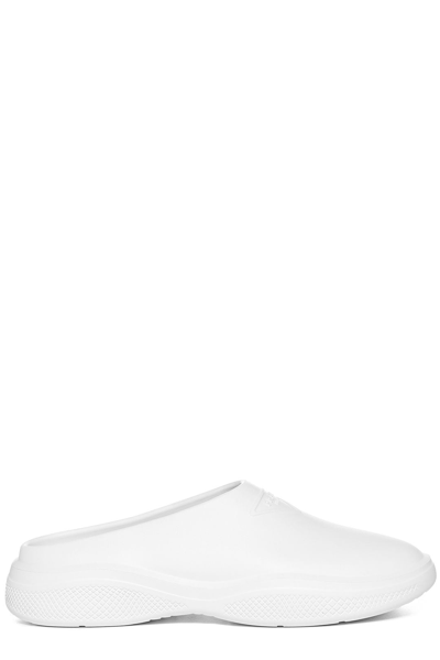 Shop Prada Logo Embossed Slip In White