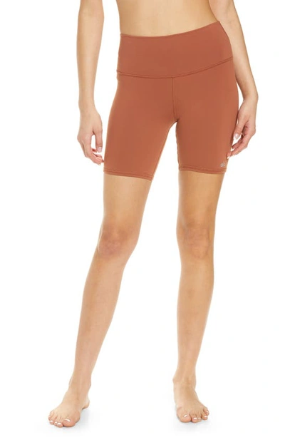 Shop Alo Yoga High Waist Biker Shorts In Rust