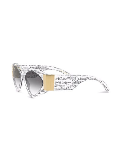 Shop Dolce & Gabbana Modern Print Graffiti Sunglasses In 9v000 Transparent