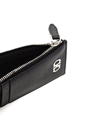 Ferragamo Logo Zipped Wallet In Black