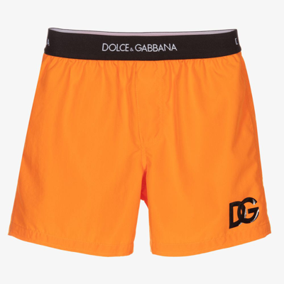 Shop Dolce & Gabbana Boys Orange Logo Swim Shorts