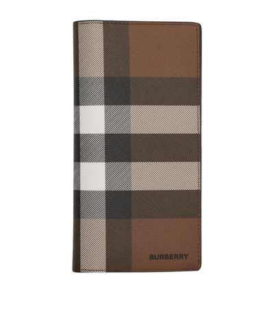 Shop Burberry Check E-canvas Continental Wallet In Brown
