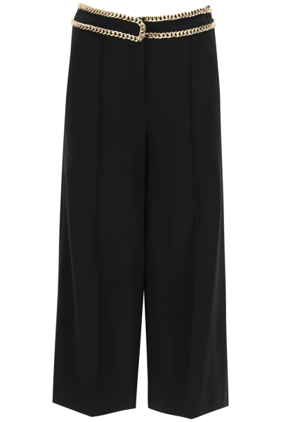 Shop Moschino Crop Trousers With Groumette Chains In Black