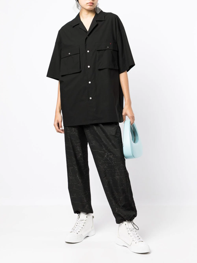 Shop Ports V All-over Logo Print Trousers In Black