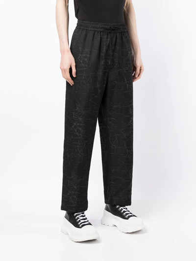 Shop Ports V All-over Logo Print Trousers In Black