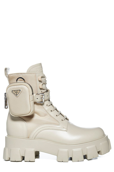 Shop Prada Monolith Pouch Strapped Ankle Boots In Beige