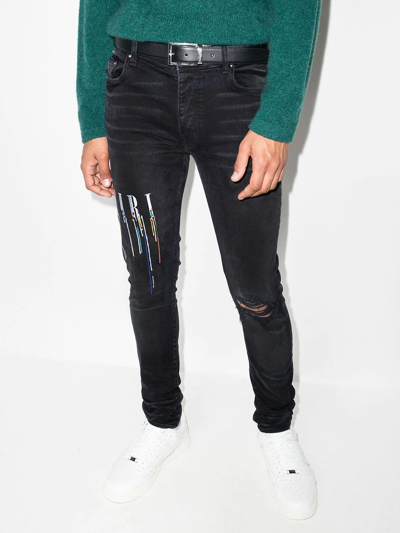 Shop Amiri Logo-embroidered Skinny Jeans In Black