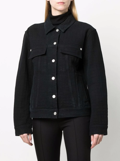 Givenchy logo-print denim jacket worn by Cane Tejada (Woody