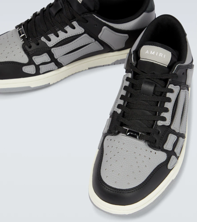 Shop Amiri Skeleton Low Top Sneakers In Black/grey