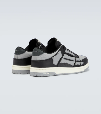 Shop Amiri Skeleton Low Top Sneakers In Black/grey