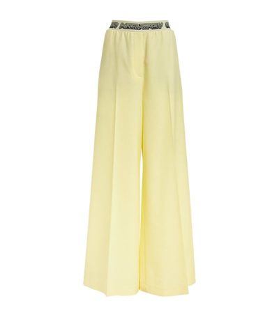 Shop Stella Mccartney Wool Logo-waistband Trousers In Yellow