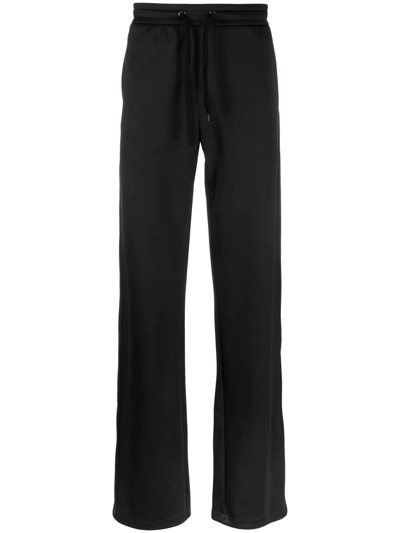 Shop Valentino Logo-print Flared Track Pants In Schwarz