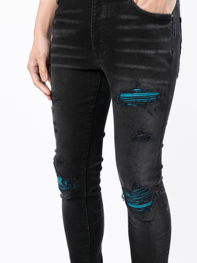 Shop Amiri Distressed Skinny-cut Jeans In Schwarz
