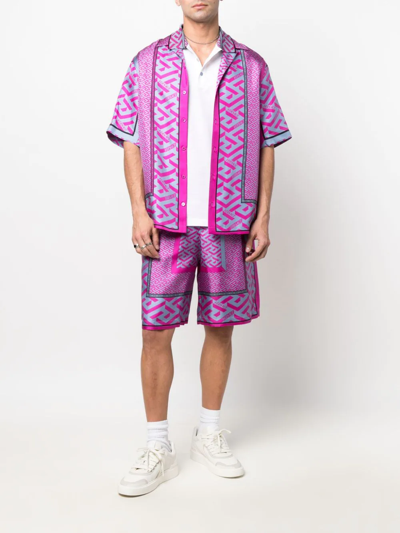 Shop Versace La Greca Panelled-print Bermuda Shorts In Pink