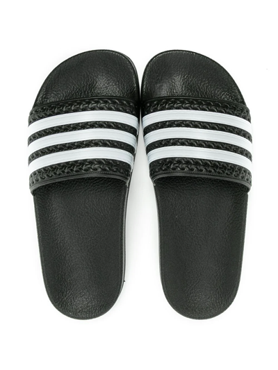 Shop Adidas Originals Adilette J Slides In Black