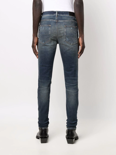 Shop Amiri Distressed Skinny Fit Jeans In Blue