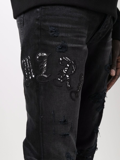 Shop Amiri Embroidered-logo Skinny Jeans In Black