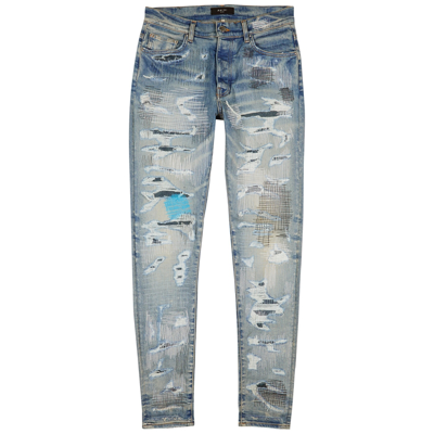 Shop Amiri Repair Blue Distressed Skinny Jeans In Denim