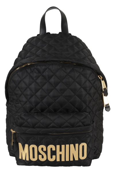 Shop Moschino Logo Patch Quilted Backpack In Black