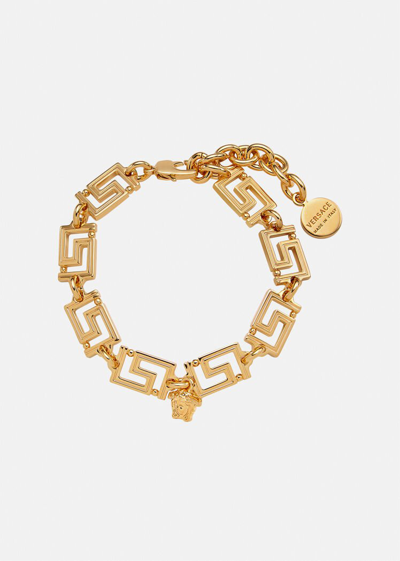 Shop Versace Greca Bracelet In Warm Gold