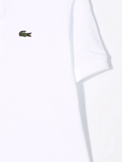 Shop Lacoste Logo-embroidered Short-sleeved Polo Shirt In Bianco