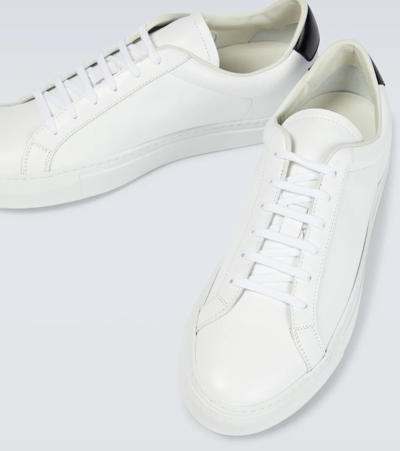 Shop Common Projects Retro Low Leather Sneakers In White/black