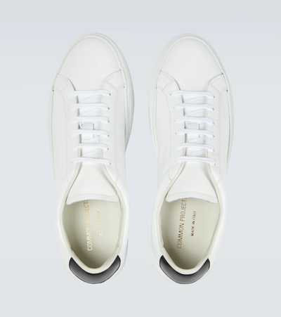 Shop Common Projects Retro Low Leather Sneakers In White/black