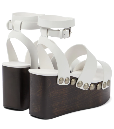 Shop Alaïa Leather Wedge Sandals In White