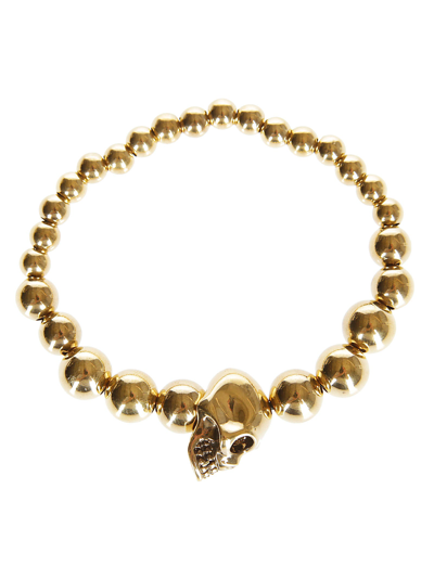 Shop Alexander Mcqueen Gold-tone Brass Skull Bracelet In Golden