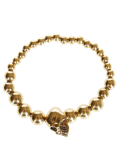 Shop Alexander Mcqueen Gold-tone Brass Skull Bracelet In Golden