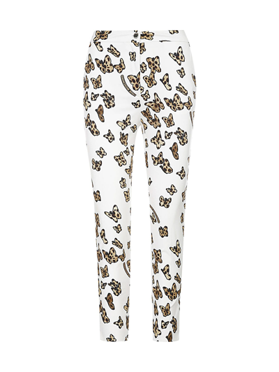 Shop Love Moschino Allover Butterfly Trousers In Whiite