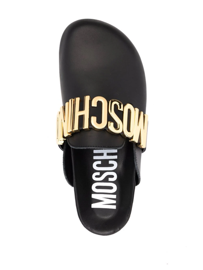 Shop Moschino Logo-plaque Leather Mules In Schwarz